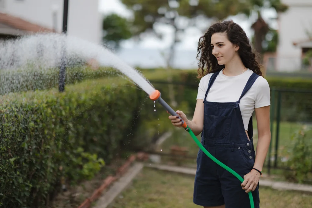 young-woman-with-curly-hair-wearing-overall-wateri-2024-12-06-19-04-03-utc